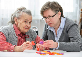 Dimensia Patient with Puzzle Pieces at Retirement Community