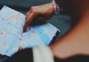 Woman's hand looking at a map