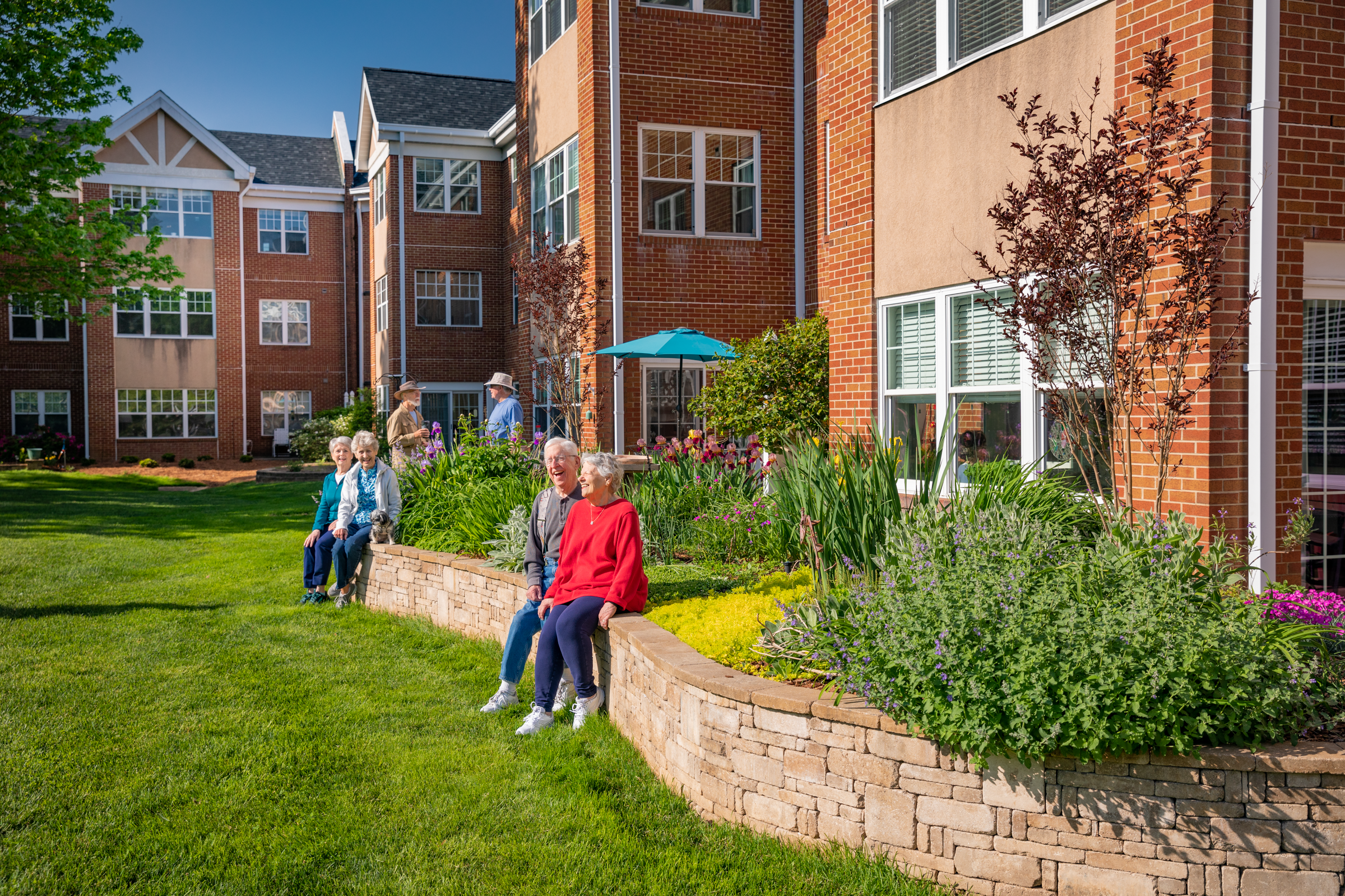 Residents relaxing outdoors and enjoying the scenery at Tryon Estates