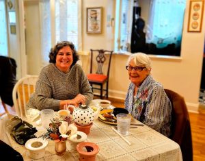 Mother and daughter having tea