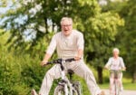Active Lifestyle with Elder Couples Riding a Bicycle Outdoors Active Lifestyle with Elder Couples Riding a Bicycle Outdoors
