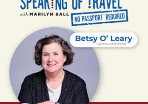Portrait of a woman with short, curly hair, wearing a dark top over a white shirt. Text reads: Speaking of Travel with Marilyn Ball. No Passport Required. Betsy OLeary - Carolina Living Choices. Retirement tips for active adults and Hendersonville airport updates.