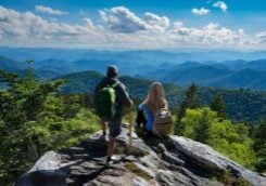 Active Adults hikers looking out over the Blue Ridge Mountains.